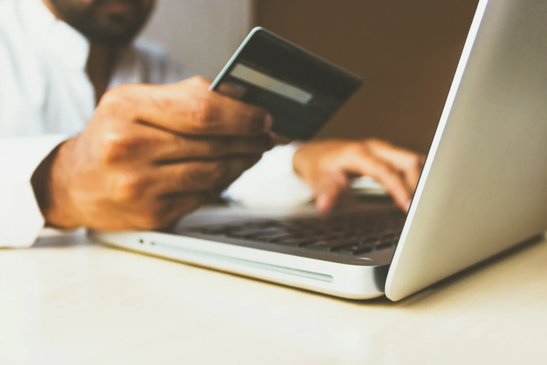 Customer using a credit card to make an online purchase
