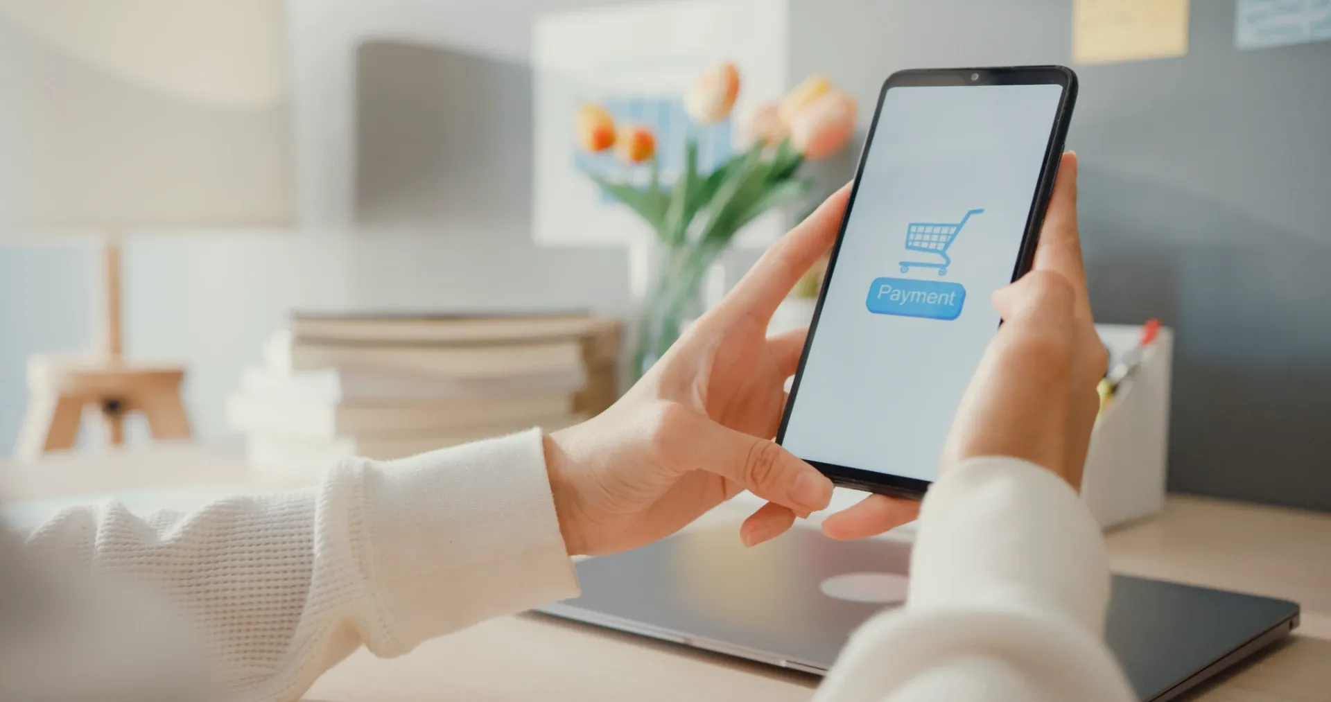 Customer making a mobile payment while shopping online